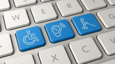Eine Tastatur auf drei Symbole statt Zahlen zu sehen sind: Illustrationen von je einer Person im Rollstuhl, einem Ohr mit Hörgerät, einer Person mit Blindenstock 
